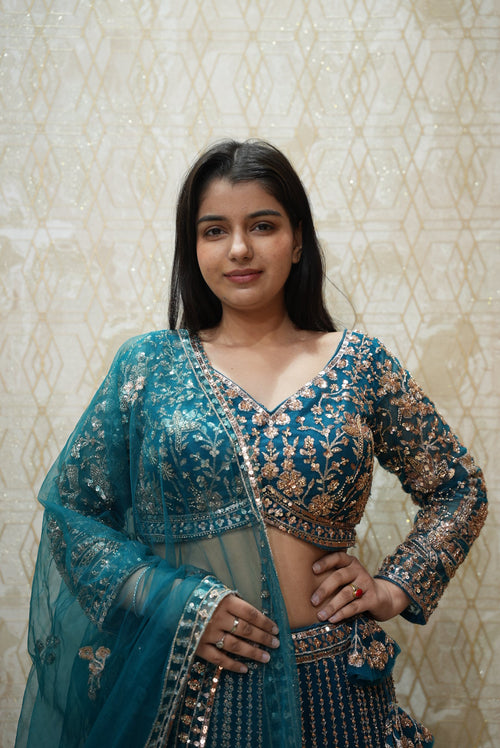 Elegant blue hues with intricate detailing — a perfect non-bridal lehenga for refined celebrations.