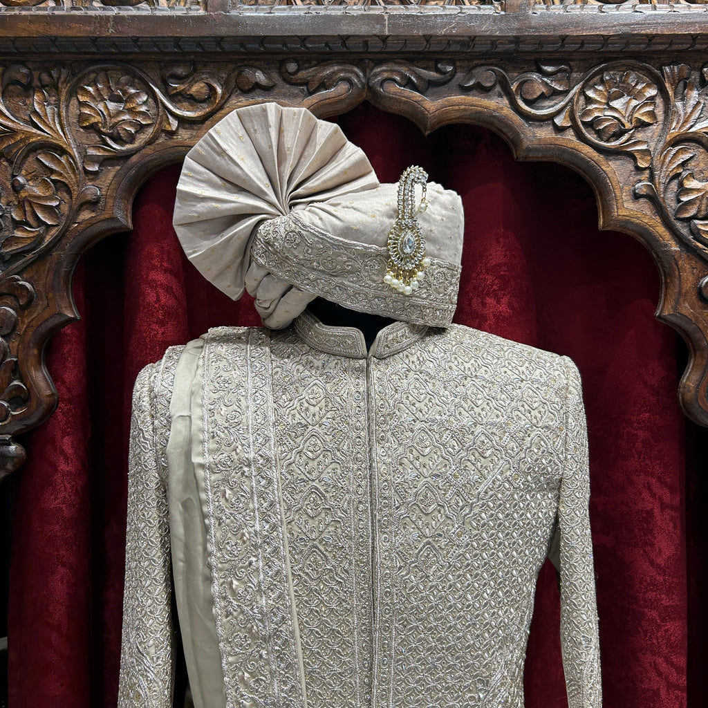 Royal elegance in Rust A timeless sherwani crafted with intricate embroidery, designed to make every groom stand out with grace and tradition.