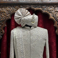 Royal elegance in Rust A timeless sherwani crafted with intricate embroidery, designed to make every groom stand out with grace and tradition.