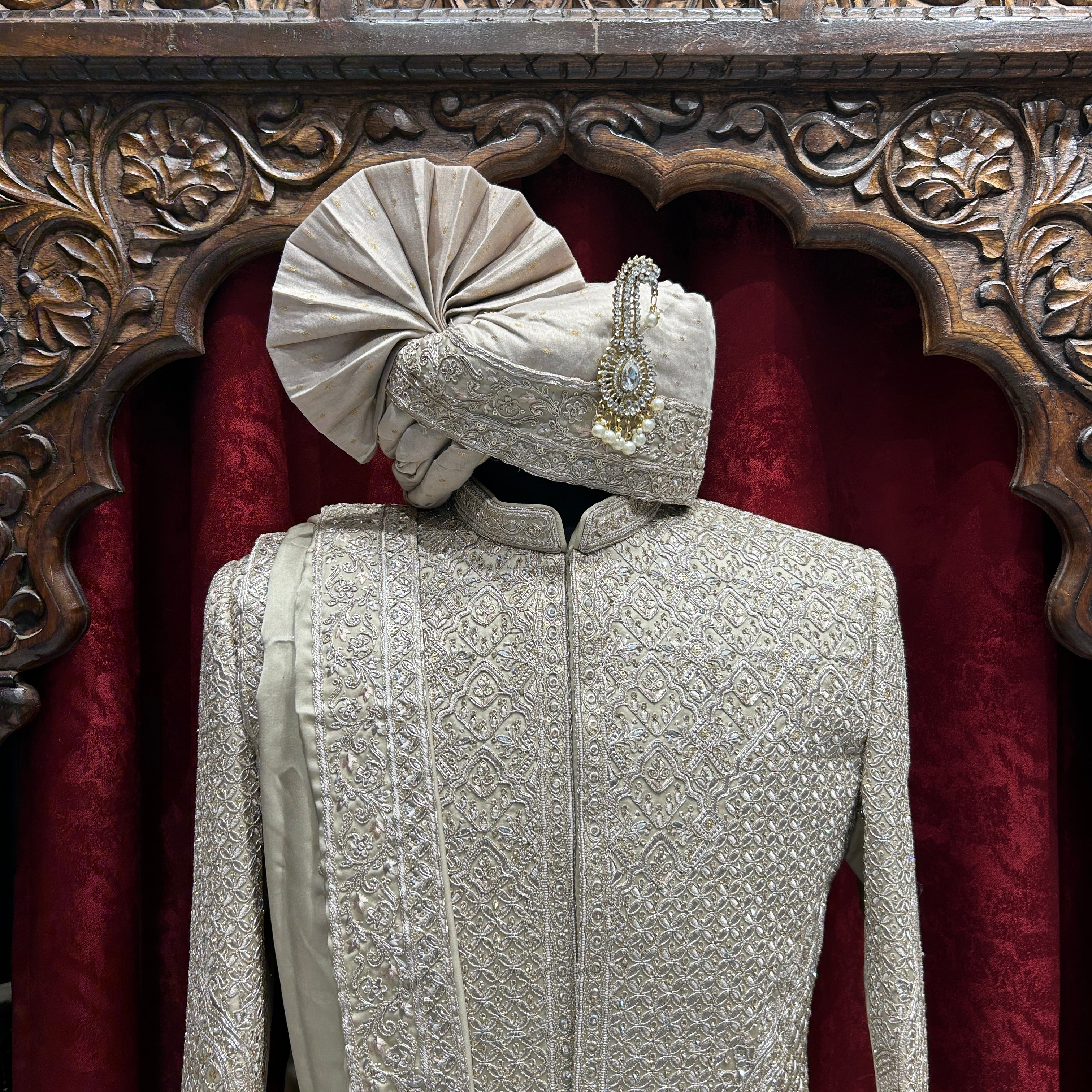 Royal elegance in Rust A timeless sherwani crafted with intricate embroidery, designed to make every groom stand out with grace and tradition.