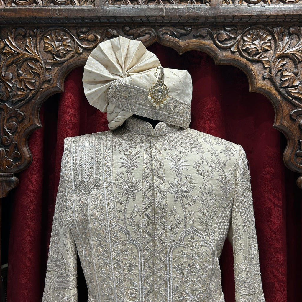Royal charm in Beige A perfect blend of elegance and tradition for the modern groom.