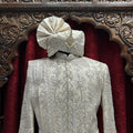 Royal charm in Beige A perfect blend of elegance and tradition for the modern groom.