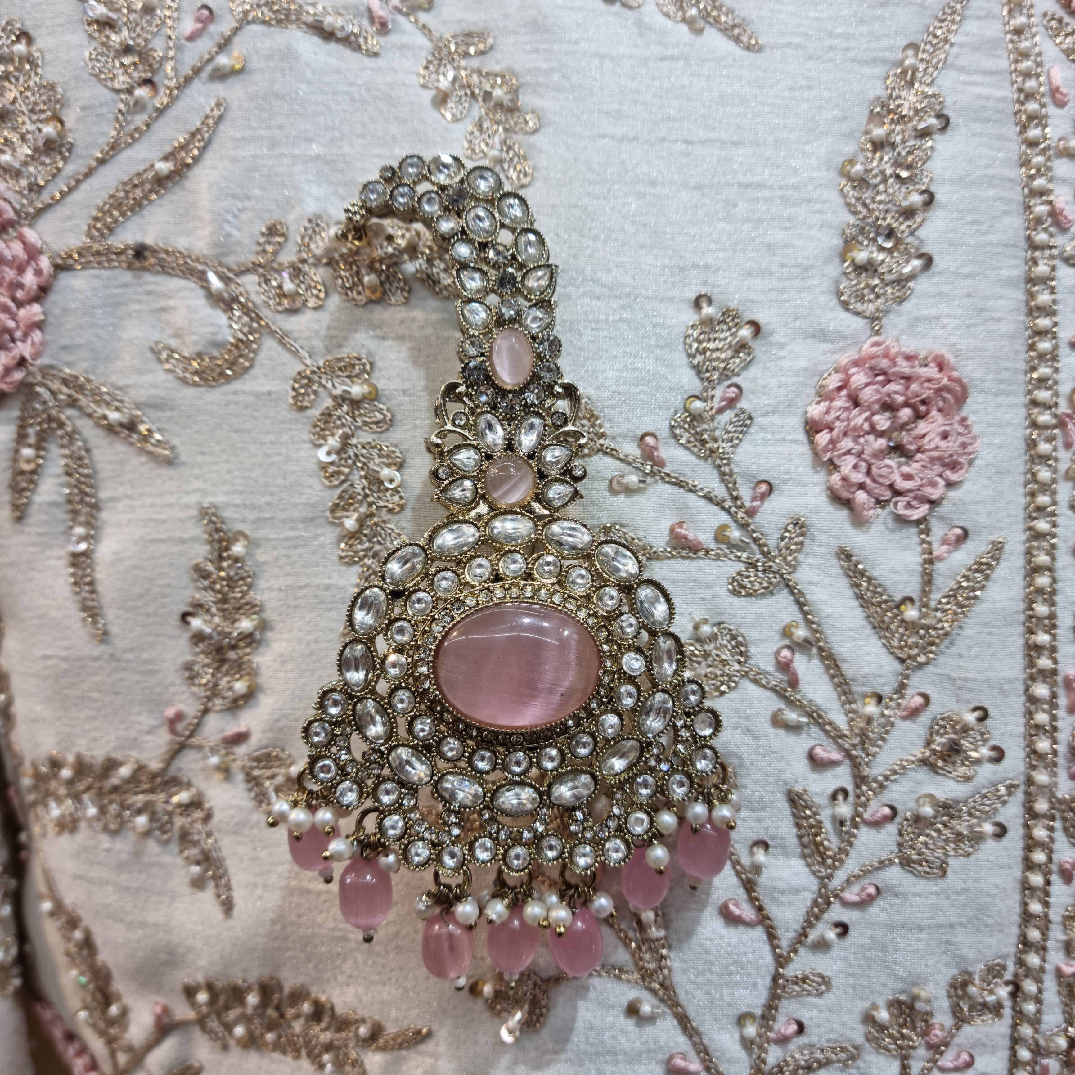 peach emerald groom jewellery with kalangi, crafted to complement traditional wedding attire.