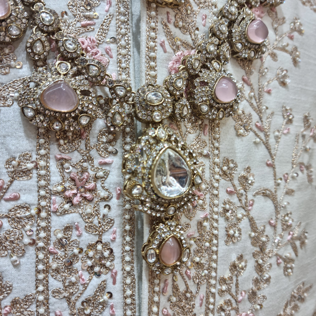 peach emerald groom jewellery with kalangi, crafted to complement traditional wedding attire.