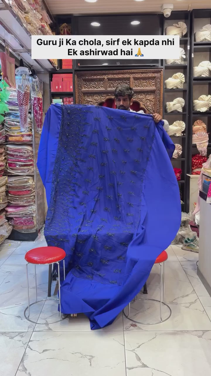 Royal Blue Guru Ji Chola Set ✨ Gracefully crafted with intricate detailing, rich velvet accents, and elegant golden lace work — a perfect blend of devotion and royalty by Rajesh Collections